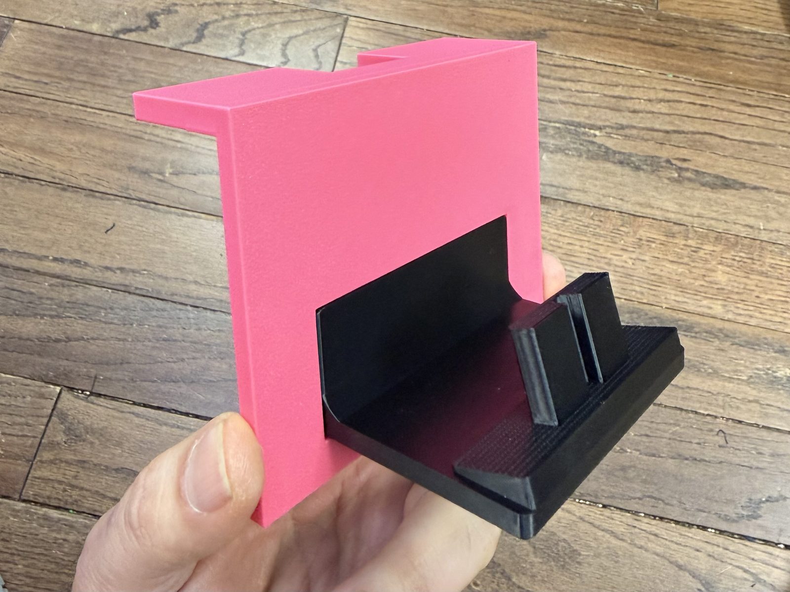 Pink AMS HT template with a black one-post holder positioned in its opening